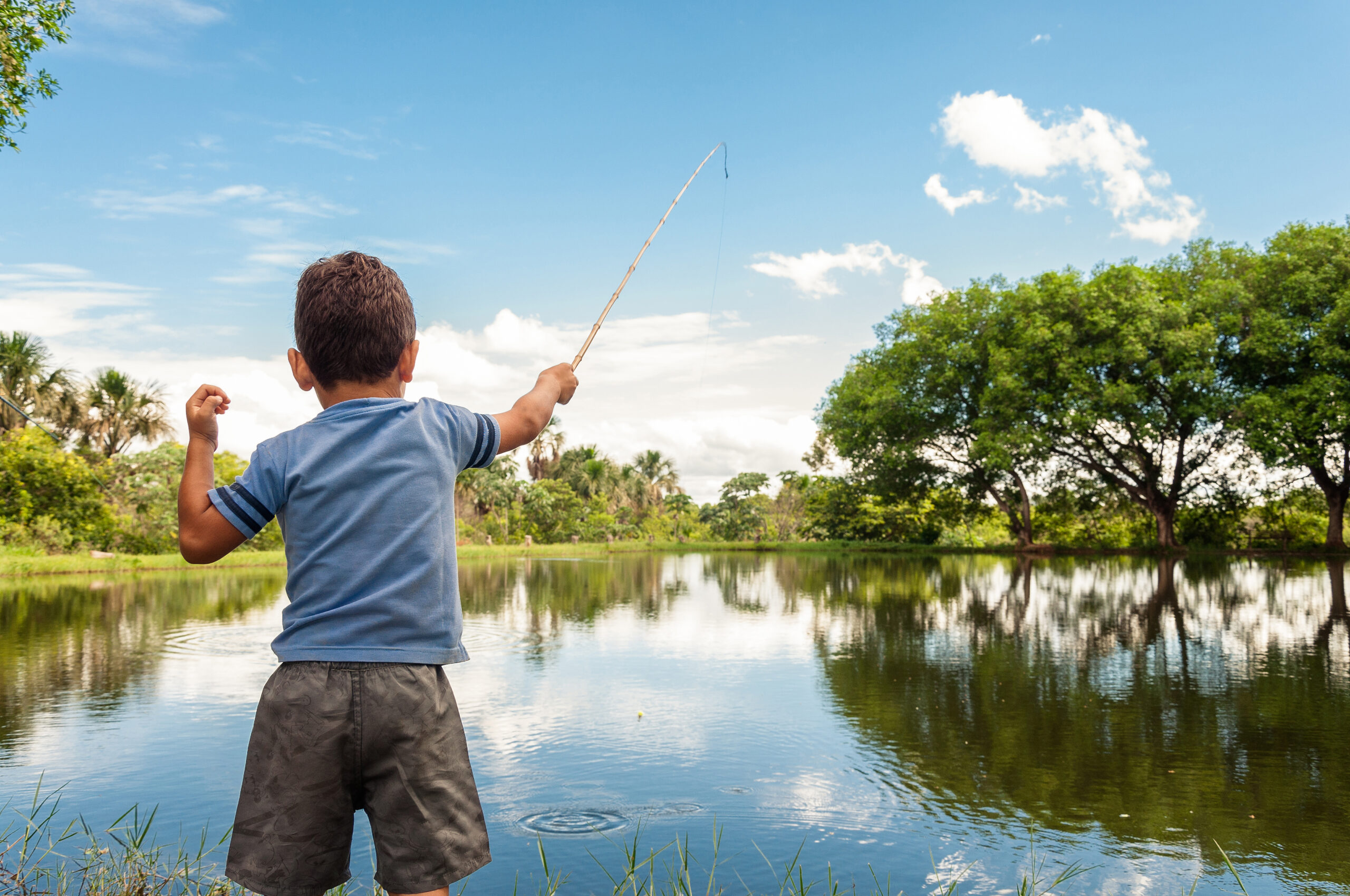 Kid,Learning,How,To,Fish,,Holding,A,Rod,On,A